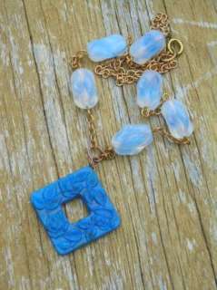   blue colored glass. Vintage opaline with blue twisted beads were hand