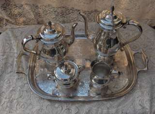Up for sale is a beautiful vintage silver plate coffee/tea service 